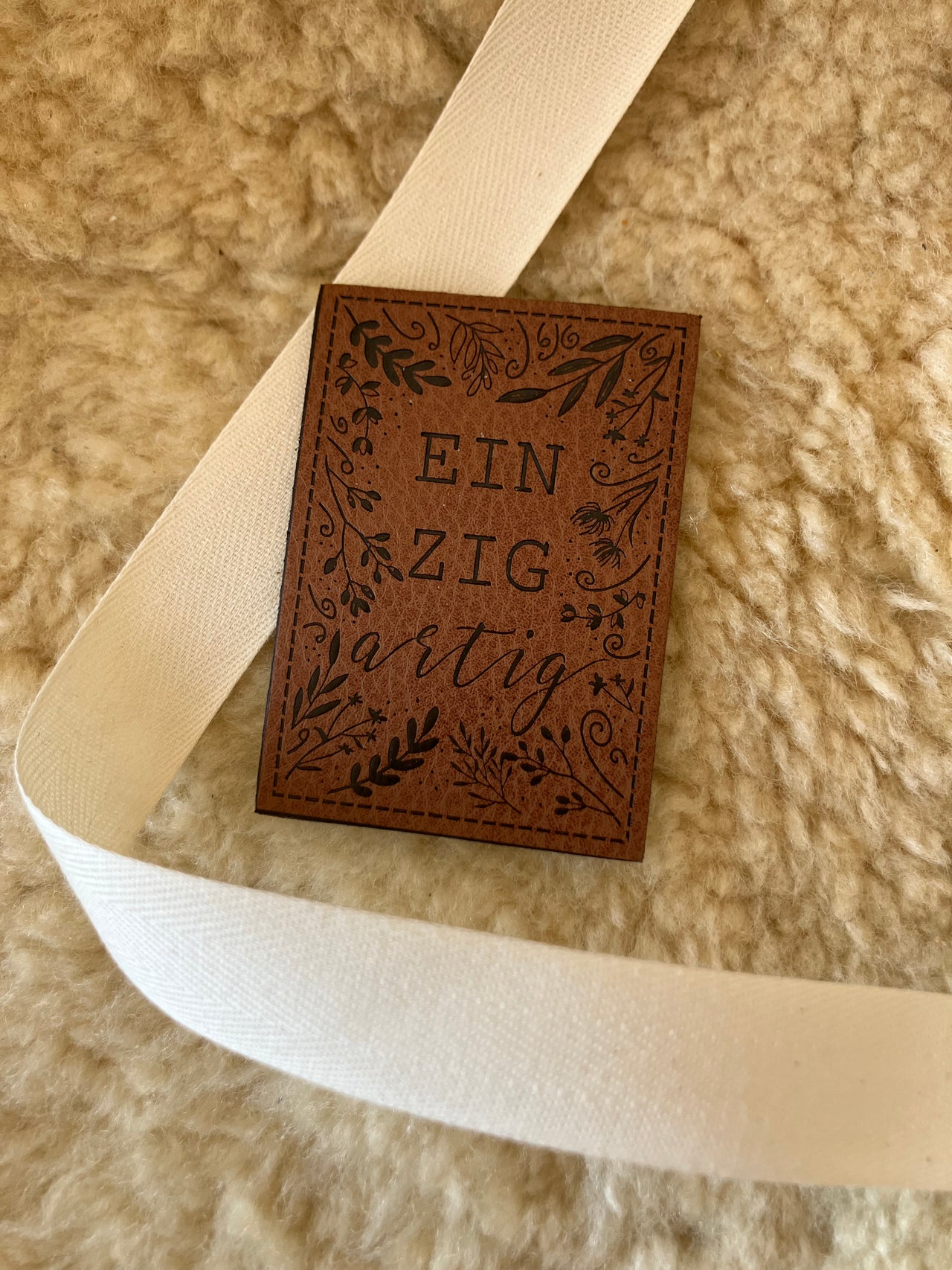 Etichetta in similpelle "Unico"